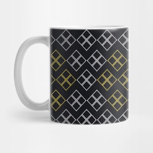 The black background fabric pattern is contrasted with white and yellow. Mug